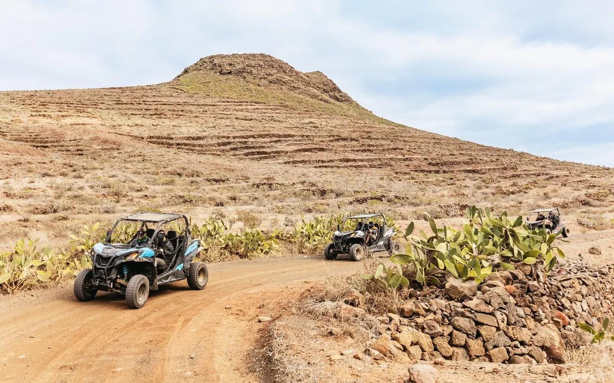 A two-seat off-road buggy on a volcanic track on Lanzarote